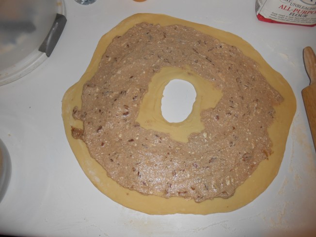 SO FUN: after mixing fillling, you roll out the dough, cut a hole in the middle and spread around